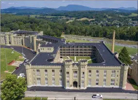  ?? STEVE HELBER— ASSOCIATED PRESS ?? This July 15, 2020file photo shows the barracks at Virginia Military Institute in Lexington, Va. Virginia Military Institute’s Board of Visitors voted Thursday, Oct. 29to remove the prominent statue of Confederat­e Gen. Stonewall Jackson that stands in front of the barracks on campus.