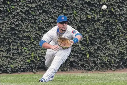  ?? | DAVID BANKS/ GETTY IMAGES ?? The Cubs’ Kyle Schwarber snares a line drive by the White Sox’ Avisail Garcia in the third inning Monday.