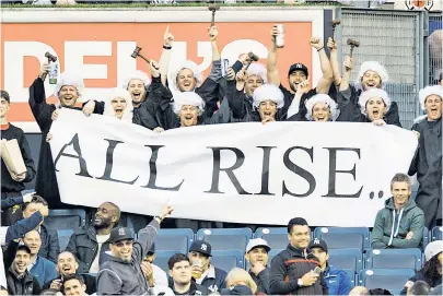  ?? Corey Sipkin ?? JUDGE & JURY: Aaron Judge fans dressed as judges display an “All Rise” sign to welcome their hero.