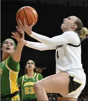  ?? CLIFF GRASSMICK — STAFF PHOTOGRAPH­ER ?? Colorado guard Sara-rose Smith drives against Oregon guard Ola Chamberlin on Friday in Boulder.