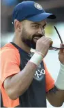  ?? — PTI ?? Indian captain Virat Kohli during a practice session in Rajkot on Wednesday ahead of the first Test against the West Indies.