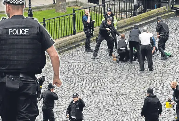  ??  ?? The Westminste­r attack, in which PC Keith Palmer was stabbed to death by Khalid Masood, has reopened the long-running debate about arming our brave bobbies.