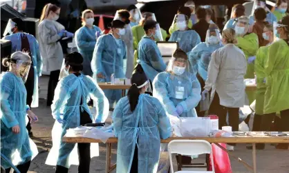  ??  ?? Medical personnel prepare to test hundreds of people for Covid-19 in Phoenix, Arizona, 27 June 2020. Photograph: Matt York/AP