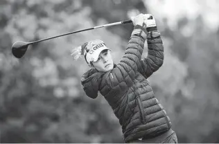  ?? Phelan M. Ebenhack / Associated Press ?? Nelly Korda tees off on the 16th hole during the third round of the Tournament of Champions LPGA golf tournament on Saturday in Orlando, Fla. Korda holds a one-shot lead.