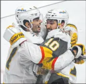  ?? Graham Hughes The Canadian Press via AP ?? Nicolas Roy, right, embraces teammate Max Pacioretty after scoring in overtime in Game 4, but from there it was all downhill for the Knights.