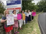  ?? SUSAN HAIGH — THE ASSOCIATED PRESS ?? Residents from various communitie­s in mostly rural northeaste­rn Connecticu­t stage a protest outside Day Kimball Hospital in Putnam, Conn.