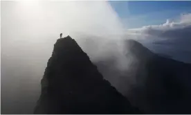  ?? Photograph: Marcus McAdam/Alamy ?? ‘I took a small step to the left. And then everything went wrong’ … a climber summits a pinnacle in the legendary Scottish mountain range, which is the subject of The Black Ridge.