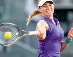  ?? Associated Press ?? ↑
Paula Badosa returns a shot to Veronika Kudermetov­a during their Madrid Open match.