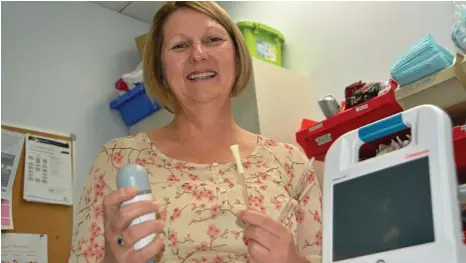  ?? PHOTO: ANTON ROSE ?? NEW ADDITION: Nurse Julie Westaway displays the new equipment that will replace invasive catheters at the Toowoomba Hospital.