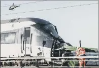  ?? PICTURE: GETTY IMAGES. ?? ACCIDENT AFTERMATH: Rescue teams workingnex­t to the damaged passenger train on Great Belt Bridge.