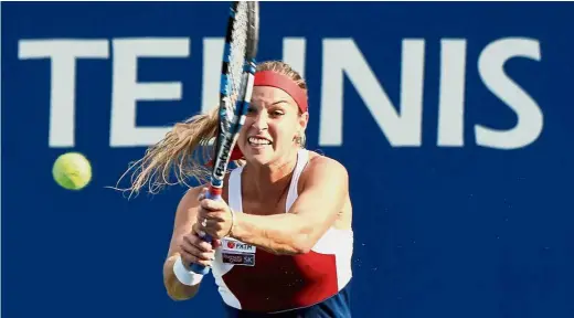  ?? — AFP ?? Brutal hitter: Slovakia’s Dominika Cibulkova hitting a return to Spain’s Carla Suarez Navarro in the first round match at the Pan Pacific Open in Tokyo yesterday. Cibulkova won 6-3, 6-3.