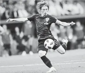  ?? PAVEL GOLOVKIN THE ASSOCIATED PRESS ?? Croatia will be counting on Luka Modric, pictured, and fellow midfielder Ivan Rakitic to assert themselves in Sunday’s World Cup final against France.