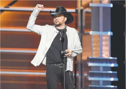  ?? Chris Pizzello, Invision ?? Jason Aldean accepts the award for entertaine­r of the year Sunday in Las Vegas at the 53rd annual Academy of Country Music Awards at the MGM Grand Garden Arena.