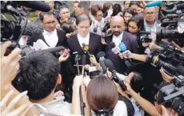  ??  ?? Naran Singh (right) and Hisyam Teh Toh Teik (centre), the counsel representi­ng Doan, speaking to media personnel outside the court.