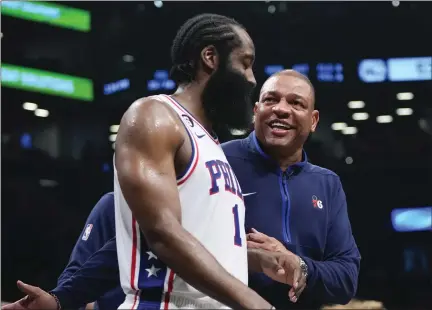  ?? FRANK FRANKLIN II - AP ?? Philadelph­ia 76ers head coach Doc Rivers, right, talks to James Harden during the second half of Game 4in an NBA first-round playoff series against the Brooklyn Nets, Saturday, April 22, in New York.
