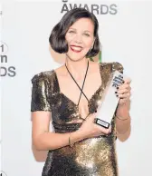  ?? EVAN AGOSTINI/INVISION ?? Maggie Gyllenhaal with the best screenplay award at the Gotham Awards on Monday.