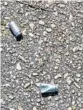  ?? DAVID FLESHLER/STAFF ?? Bullet casings are found on the road that runs near spot where fisherman died.