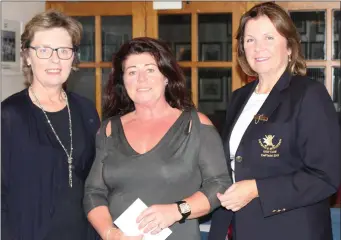  ??  ?? Clodagh Corry, winner of Class 2 in the competitio­n sponsored by Victor Dwyer Shoes at Laytown & Bettystown Golf Club, is presented with her prize by Margo Dwyer and Lady Captain Susan Clark.