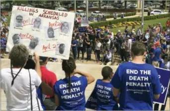  ?? KELLY P. KISSEL — THE ASSOCIATED PRESS ?? Protesters gather outside the state Capitol building on Friday in Little Rock, Ark., to voice their opposition to Arkansas’ seven upcoming executions.