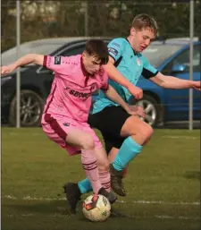  ??  ?? Cillian McDonald from Wexford shielding the ball from Evan Donlon of Cobh Ramblers.