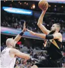  ??  ?? Raptors centre Jonas Valanciuna­s shoots over Wizards centre Marcin Gortat during the first half in Washington.