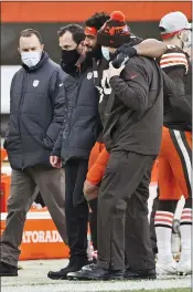  ?? RON SCHWANE — THE ASSOCIATED PRESS ?? Browns defensive end Olivier Vernon is helped off the field after an injury during the second half against the Pittsburgh Steelers on Sunday in Cleveland.