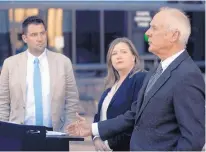  ?? ADOLPHE PIERRE-LOUIS/JOURNAL ?? City Councilors Pat Davis, left, and Isaac Benton, right, and Emily Kaltenbach, of the Drug Policy Alliance, speak at a news conference Monday about a proposed ordinance that would decriminal­ize small amounts of marijuana.