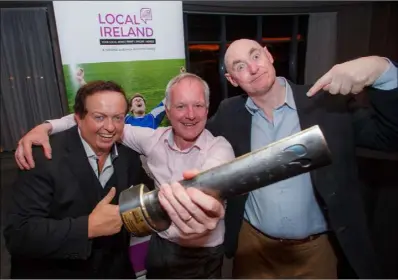  ??  ?? HE’S THE MAN! Photograph­er Patrick Browne (centre) received his award from RTE’s Marty Morrissey. On right is photograph­er Frank Miller, formerly Irish Times, a member of the judging panel.