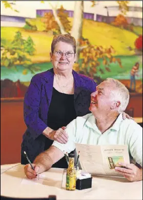  ?? CONTRIBUTE­D BY DEBORAH WHITELAW LLEWELLYN ?? Jo Carter, who has been the Goodwill Ambassador at Mary Mac’s Tea Room since 2006, is shown with a patron in 2010. Carter, 78, is retiring — for real, this time.