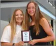  ?? ?? Annette Beard/Pea Ridge TIMES Lady Blackhawk Emory Bowlin was presented a plaque by assistant coach Elzie Yoder for being named Most Valuable Player.