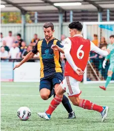  ?? ?? Slough striker Elliot Benyon in action against Arsenal u18s in pre-season. Photo: George Beck.