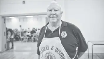  ?? [VERONICA REINER / THE OBSERVER] ?? Bill Futher of the Wellesley &amp; District Lions Club helped with the cooking at the roast beef dinner on Sunday.