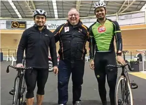  ??  ?? Training in Melbourne: Mohd Shah Firdaus (right) with coach John Beasley and teammate Azizulhasn­i Awang.