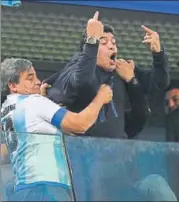  ?? AFP PHOTO ?? Diego Maradona (right) was criticised for his gesture during Argentina’s win over Nigeria.