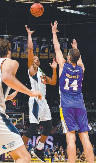  ?? Picture: AAP ?? GOOD SIGNS: Devon Hall (centre) of the Taipans shoots for a basket during the Round 3 NBL match against Sydney Kings at Qudos Bank Arena in Sydney.