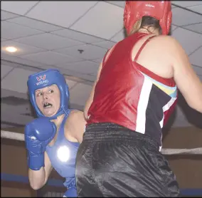  ??  ?? Truro fighter Amanda Dowe (in blue) won a hard-fought victory for Beyond Boxing against her opponent Cynthia Denny from Albion Boxing. The two boxers faced off in Beyond Boxing's first- ever fight card at the Best Western Glengarry Friday.