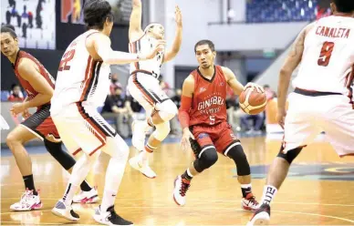  ?? (PBA Images) ?? Barangay Ginebra San Miguel playmaker LA Tenorio uses a pick set by teammate Japeth Aguilar, left, to get past Blackwater’s Mike Tolomia during their PBA Philippine Cup game at the AUF Arena powered by Smart 5G. Ginebra won 103-99.