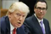  ?? AP PHOTO/EVAN VUCCI ?? U.S. Treasury Secretary Steven Mnuchin listens at right as President Donald Trump speaks during a 2017 meeting on the Federal budget in the Roosevelt Room of the White House in Washington.