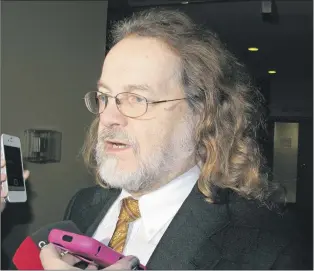  ?? ROSIE MULLALEY/THE TELEGRAM ?? Defence lawyer Bob Buckingham, who represents suspected murderer Ray Stacey, speaks to reporters outside provincial court in St. John’s Friday about what he believes is the unfair treatment of his client.