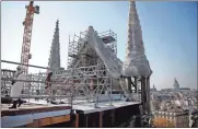  ??  ?? The reconstruc­tion site of the Notre-dame cathedral is pictured Thursday in Paris.