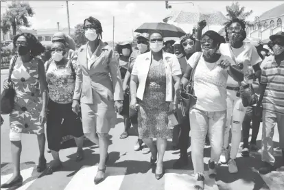  ?? (Orlando Charles photo) ?? Volda Lawrence (third from left) and Carol Joseph (second from left) with PNCR supporters