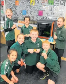  ?? PHOTOS: SUPPLIED ?? Children at the Waipawa Library in front of one of the new 3D printers, and a 3D creation.