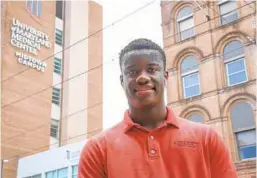  ?? ULYSSES MUÑOZ/BALTIMORE SUN ?? Kalen Jones outside University of Maryland’s Midtown Campus. Jones attends Baltimore Polytechni­c Institute. He’ll work as a patient advocate for UMMC.