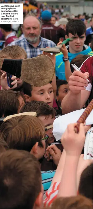  ?? DAIRE BRENNAN/SPORTSFILE ?? Joe Canning signs autographs for supporters after Galway’s victory over Dublin in Tullamore