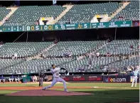  ?? JED JACOBSOHN/ASSOCIATED PRESS FILE PHOTO ?? Oakland Athletics starting pitcher James Kaprielian throws during a June 12 game against the Tampa Bay Rays at the Oakland Coliseum in Oakland, Calif. The A’s lease at the Coliseum expires after this season.