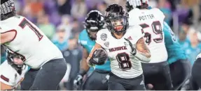  ?? AP ?? Northern Illinois running back Jay Ducker runs the ball against Coastal Carolina during the Cure Bowl on Dec. 17 in Orlando, Fla.