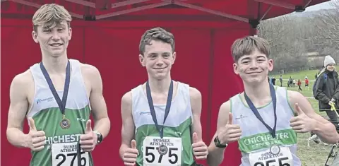 ?? ?? Chichester’s medal-winning U15 boys, Ben Stewart, Isaac Siddle and Harry Cruttenden | Picture from Chi Runners