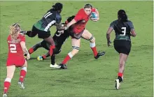  ?? WILLIAM WEST AFP/GETTY IMAGES ?? Canada’s Hannah Darling (second from right) is tackled by the Kenyan defence in their women’s rugby sevens match on Friday.