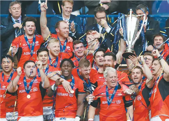  ?? PICTURE: Getty Images ?? Triumph: Saracens lift the Champions Cup after beating Clermont