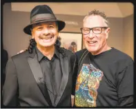  ?? Jay Blakesberg ?? The show’s producer, Kenny Wardell (right) of BAM magazine, shown with Carlos Santana, hopes to revive the communal spirit of the original Bammie parties.